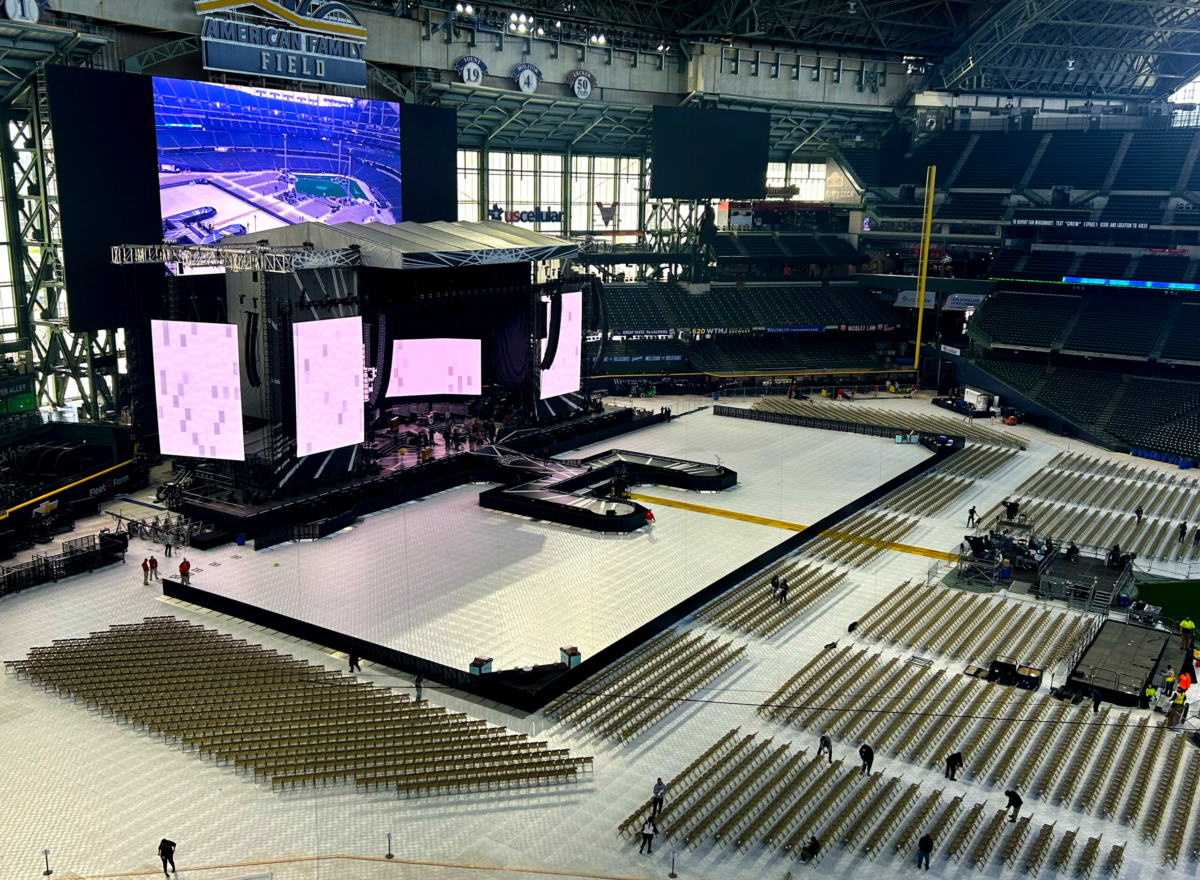 empty stadium with stage, seating, and barrier for luke combs show.