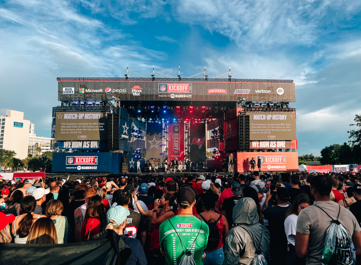 Outdoor mobile stage for NFL kickoff with crowd